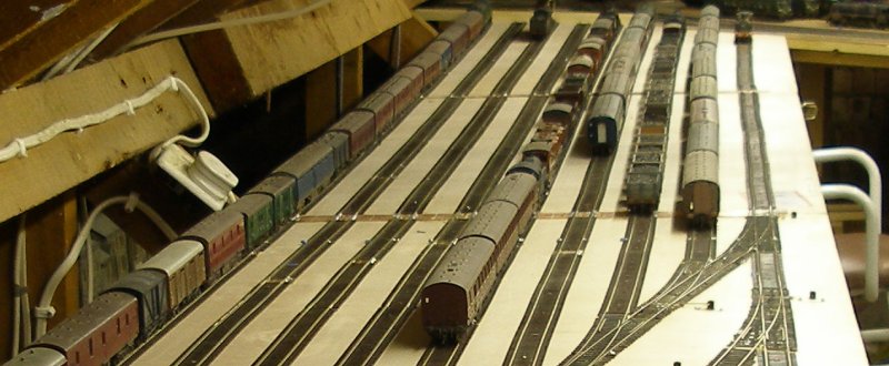 The new Hall Royd storage sidings showing a freight from Fleetwood and a local steam hauled passenger train have arrived.