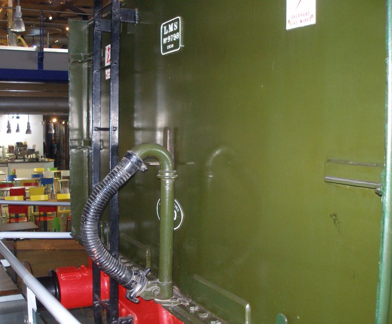 Stanier 'Coronation' Pacific 46235 'City of Birmingham' as seen in the ThinkTank Museum on 10 October 2015.  Rear of tender, showing vacuum brake hose. Note pipe is painted the same colour as the tender body.