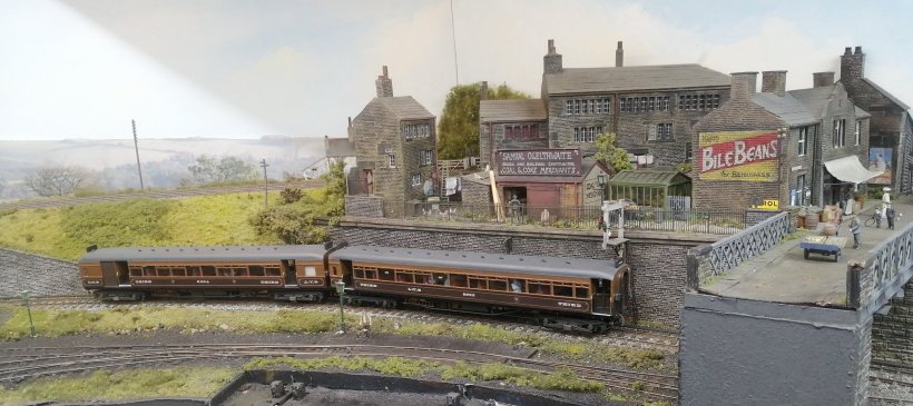 Thurlstone GCOO model: LYR 2-car electric set departs from Bullhouse, and passes under the main road bridge.