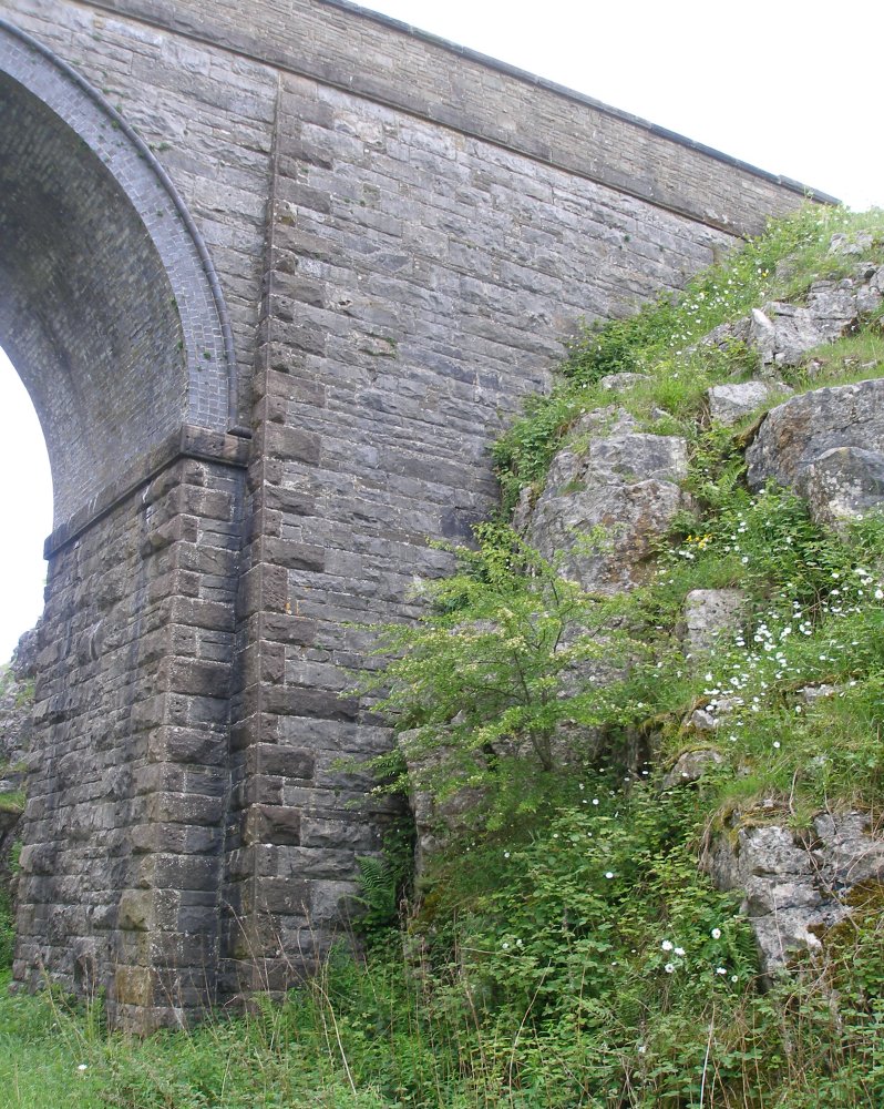 Tall bridge in rock cutting on the ex-LNWR line from Boxton to Ashbourne.