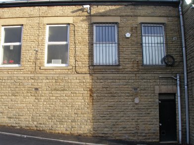 Todmorden Railway Station: first section of southern wall of main station building  westwards from entrance on 19 April 2013