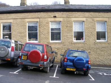 Todmorden Railway Station: third section of southern wall of main station building  westwards from entrance on 19 April 2013