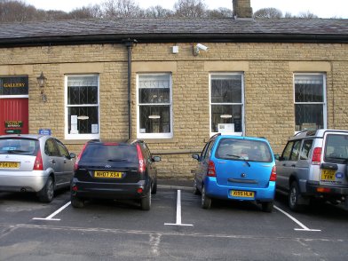 Todmorden Railway Station: fourth section of southern wall of main station building  westwards from entrance on 19 April 2013