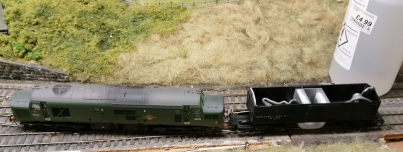 Triang track cleaning car in operation with IPA bottle in the background