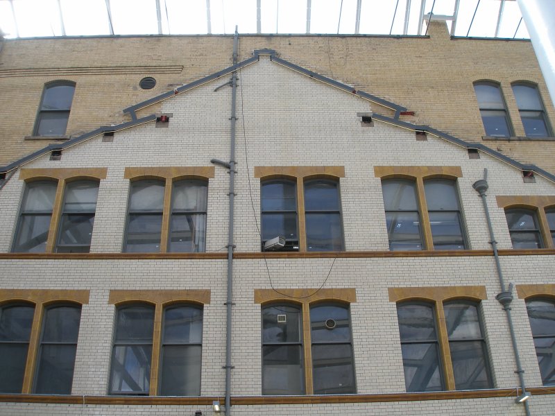 Manchester Victoria Railway Station 11 April 2015 on the occasion of a guided tour organised by the Lancashire & Yorkshire Railway Society: the location of the train shed roof is marked out by illuminated strips on the original office block