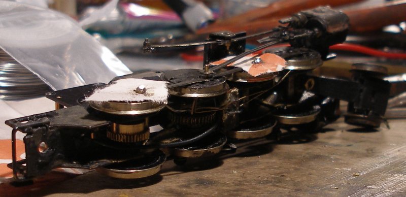 Fitting Romford crank pins -6: The end of the pins are cut off, and the ends lightly dressed with a file. Don't file them to their final height at this stage, as they may yet have to removed and remounted, and it is best to have a little of 'play' available, particularly as these pins have been superglued in, and there's no way back! The connecting rod has now been fitted over the middle crank pin.