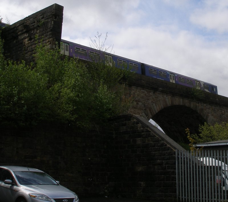 Second train to Manchester Victoria from Blackburn via Todmorden crosses Todmorden viaduct, as seen from the site of the coal drops